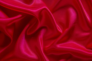 Red cloth waves background texture.