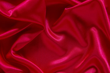 Red cloth waves background texture.