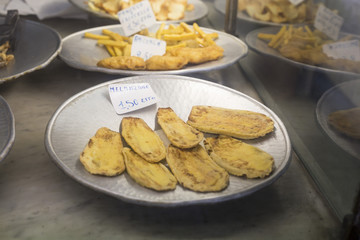 image with detail of a dish with fried aubergines