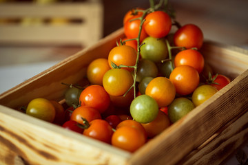 fresh tomatoes in a wooden box