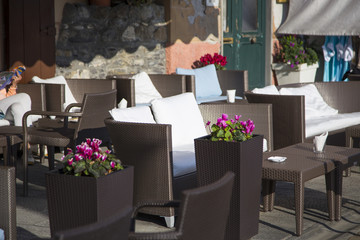 image of rattan sofas and tables with white cushions