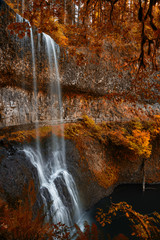 Waterfall in magical autumn wonderland