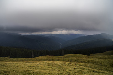 Landscape with curtains of torrential heavy rain in the mountains