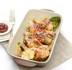 grilled chicken legs with sesame  in a  plate on a white background
