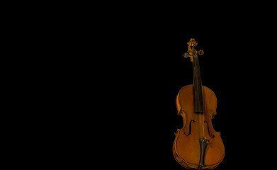 image of a violin photographed frontally with a black background