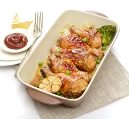 grilled chicken legs with sesame  in a  plate on a white background