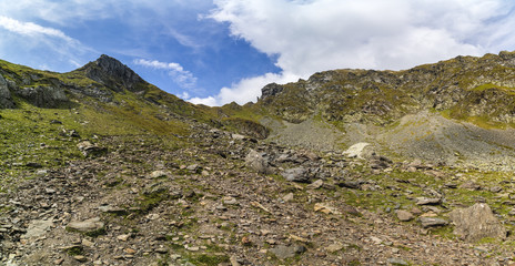 Landscape with rocky mountain peaks in summertime
