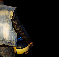biker with helmet on black background
