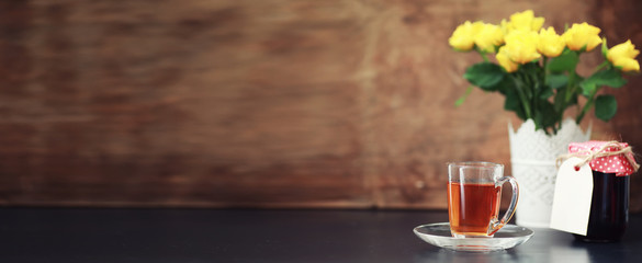 A cup with tea on the table