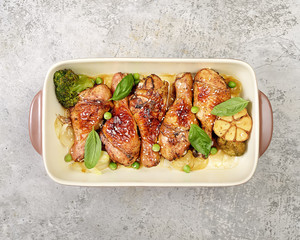 grilled chicken legs with sesame on  plate 