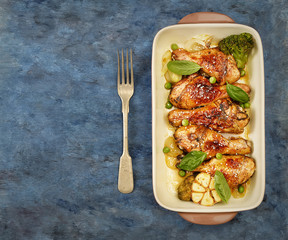 grilled chicken legs with sesame on  plate 