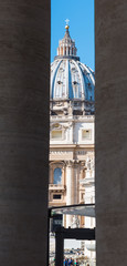 Fototapeta na wymiar World famous Saint Peters dome seen through columns