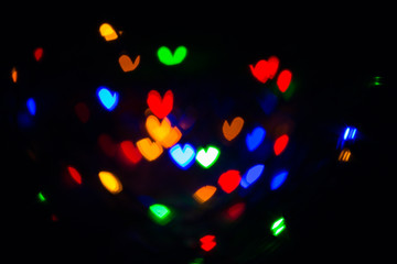 Lights of a New Year's garland in the form of a heart.
