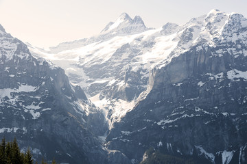 Obraz premium Three peaks of mountain Alps looking from grindelwald first peak electric cable car , Switzerland Europe