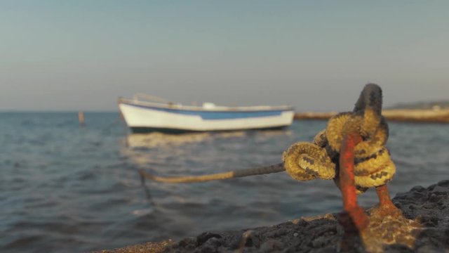 Fiberglass boat moored at sea side