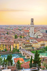 View of the historic city center along Adige river at sunset in Verona, Italy. - obrazy, fototapety, plakaty