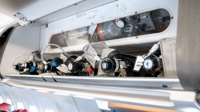 Closeup image of emergency safety system wuth valves and tubes on modern jet airplane