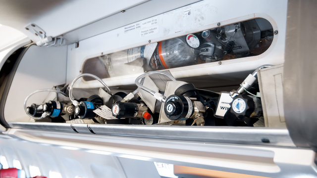 Closeup image of cylinders with oxygen in case of emergency on the aircraft