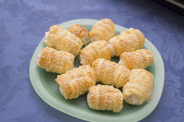 horizontal image with high view of a plate of salted cannoli on a table
