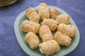 horizontal image with high view of a plate of salted cannoli on a table