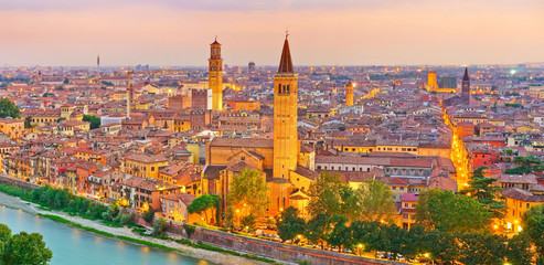 Fototapeta na wymiar View of the historic city center along Adige river at sunset in Verona, Italy.