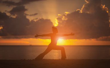 Fototapeta premium Yoga on the beach Silhouette style.