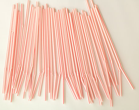 Close-up Top Plastic Red Plastic Straws For Drink, Isolated On White Background.