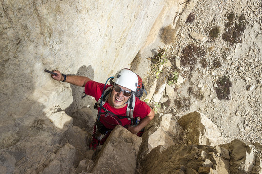 One person in the amazing famous "Caminito del Rey" a path at 100m above the ground on a steep gorge called "Desfiladero de los Gaitanes", best trekkings in Andalusia and Spain, an awesome adventure