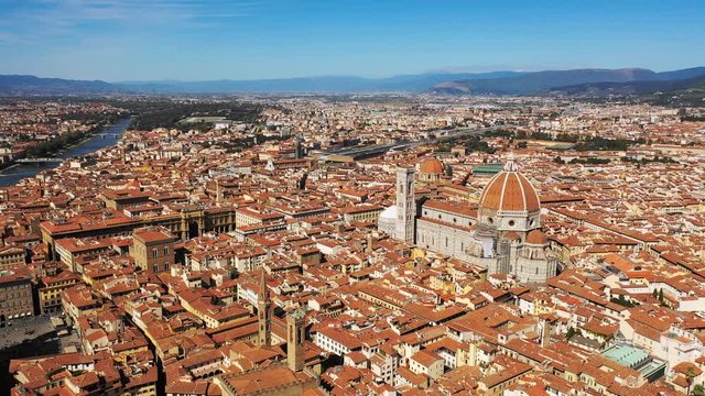 Aerial panoramic view of cityscape of Florence, famous historical city in Italy, domed cathedral Santa Maria del Fiore (The Duomo), landscape panorama of Europe from above