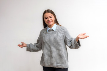 Portrait of a teen girl on a white background in various poses, smiling and looking happy.