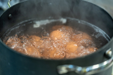 Eggs Boiling in Water