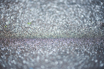 Gray or blue bokeh background of glitter lights