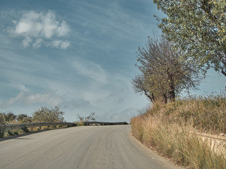 Fototapeta premium Shot of a rural road in a sunny day