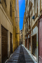 Fototapeta na wymiar Deserted alley in a italian old city