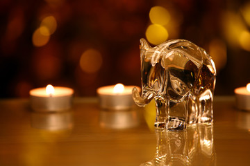 Glass Elephant figure Wax Gold bokeh reflection 