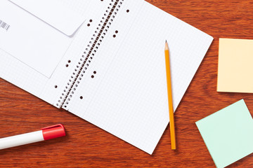 Notepad, paper, pen, pencil for study or work in the office.