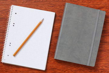 Notepad, paper, pen, pencil for study or work in the office.