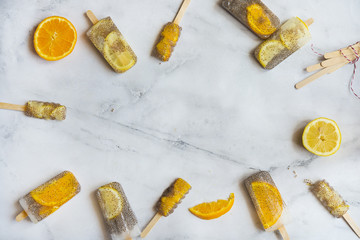 Popsicle of orange and lemon with chia