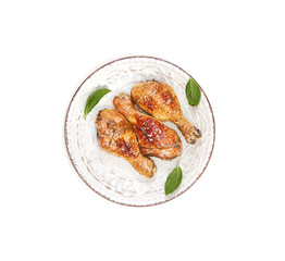 grilled chicken legs with sesame  in a  plate on a white background