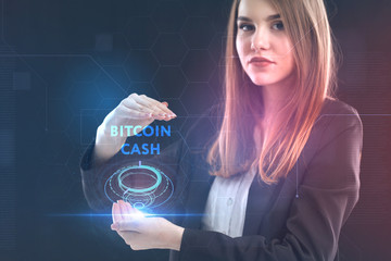 The concept of business, technology, the Internet and the network. A young entrepreneur working on a virtual screen of the future and sees the inscription: bitcoin cash