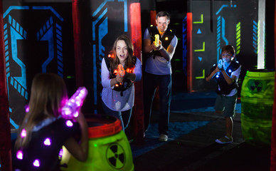 Kids and adults on lasertag arena