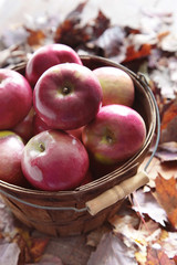 Red apples in wooden basket