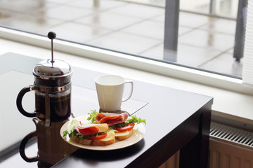 Breakfast with sandwich and coffee