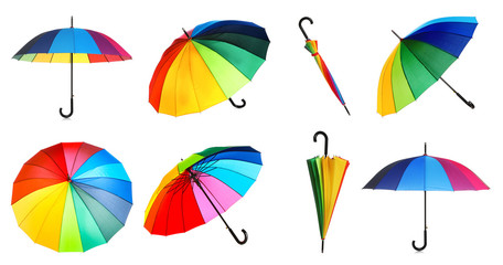 Set with elegant rainbow umbrella from different views on white background © New Africa