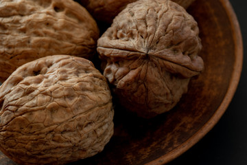large walnuts on black background