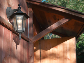 lantern on wooden wall