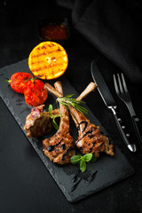 Grilled lamb rack with spices and sauce