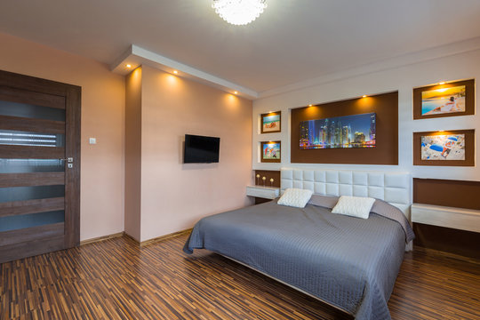 Brown and beige master bedroom interior