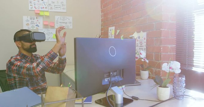 Male executive using virtual reality headset 4k