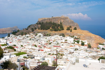 Obraz premium Lindos town cityscape and Lindos acropolis, Rhodes island, Greece